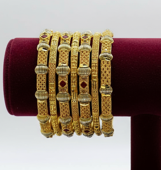 Radiant Glamour: Gold-Plated Bangles with Red Stone