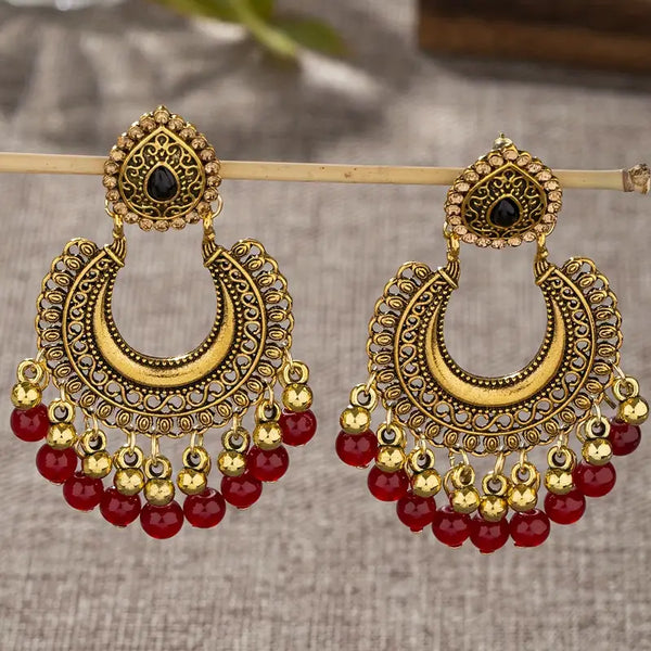 Lunar Beauty: Gold Crescent Earrings with Red Bead Details