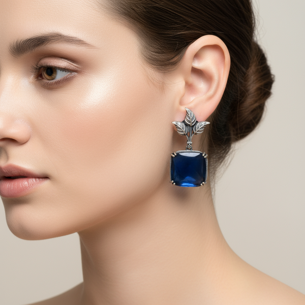 Artistic Flair: Designer Leaf Earrings with Sky Blue Stone